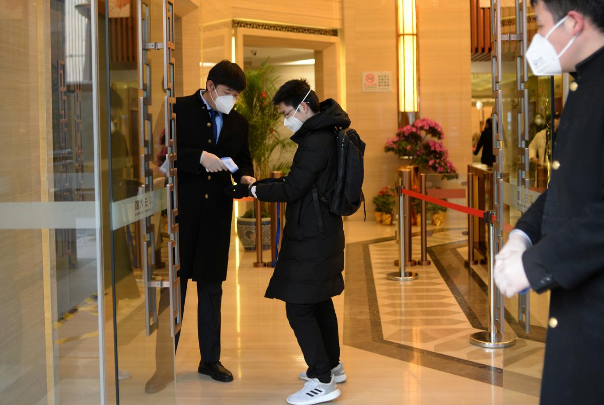 Nearly 100 more die from coronavirus in China, workers start to return to offices and factories