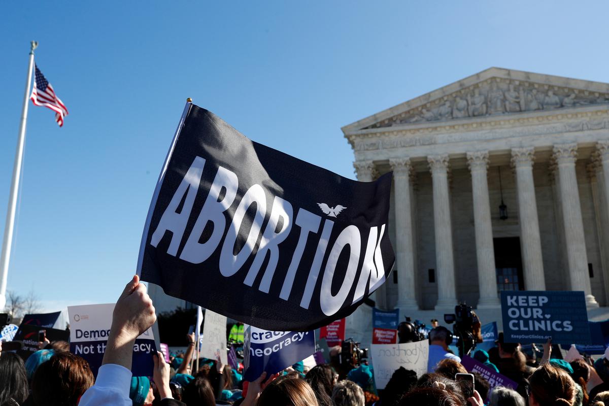 U.S. Supreme Court justices divided in abortion case; Roberts might hold crucial