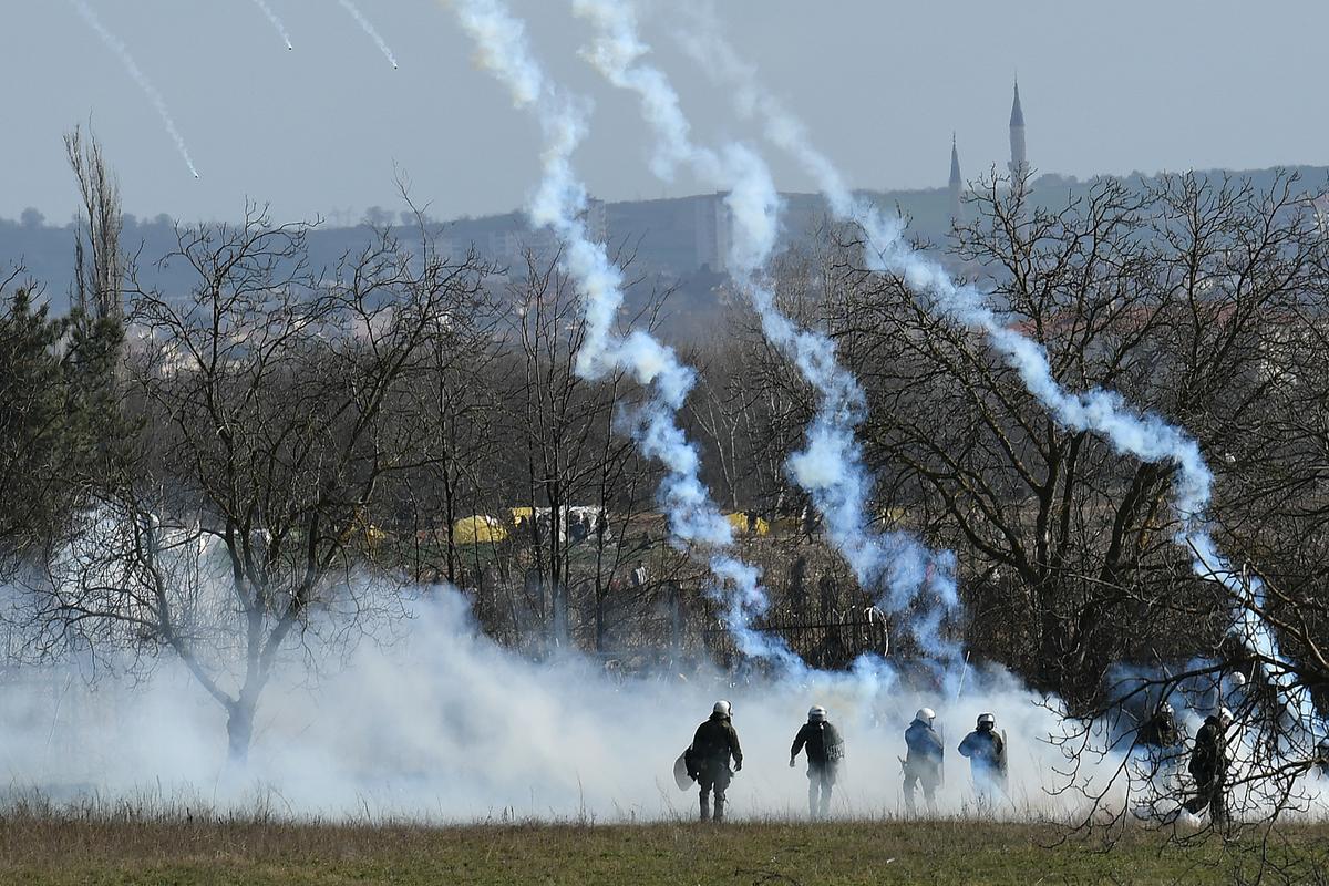 Teargas fired on Greek-Turkish border as migrant stress flare