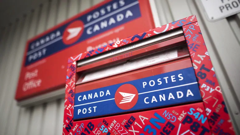 Canada Post to reduce hours, install clear barriers in response to COVID-19 | CBC News