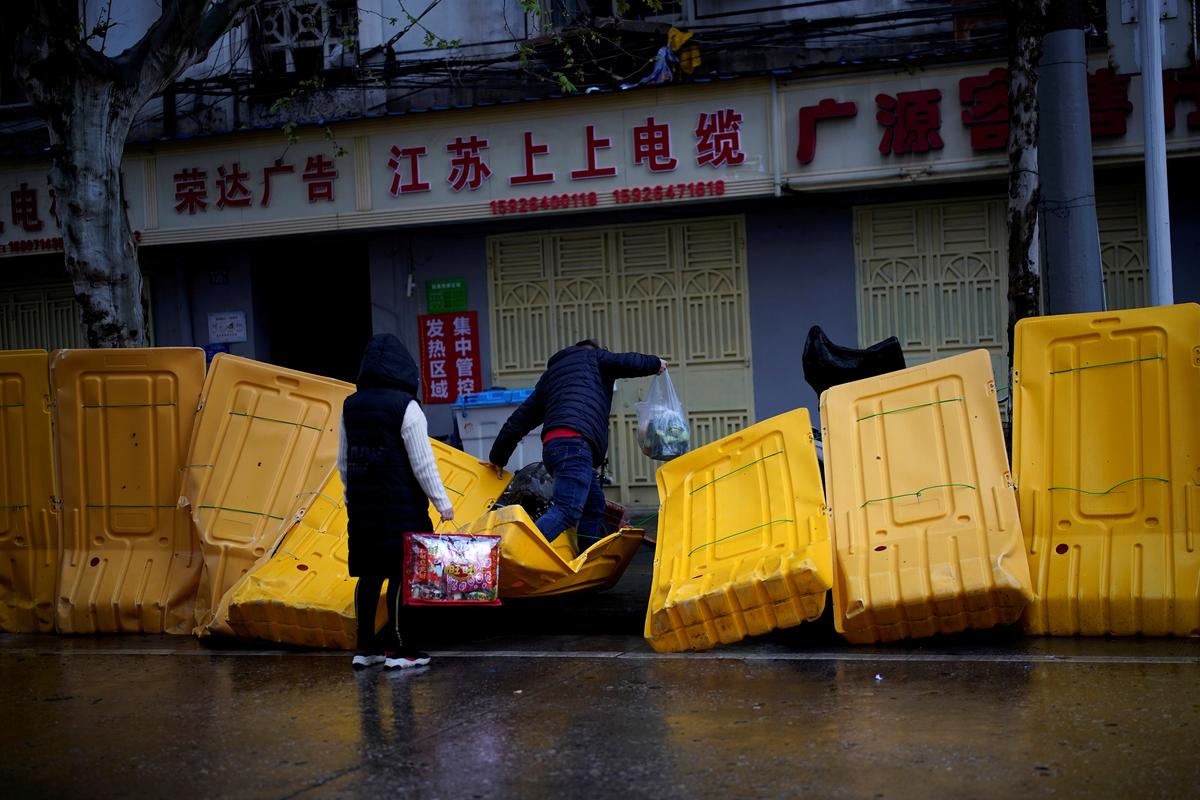 In China, walled up Wuhan awaits life beyond the barricades