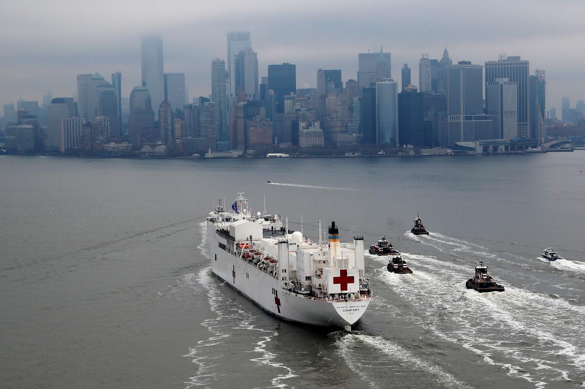 New York cheers arrival of hospital ship as coronavirus cases soar