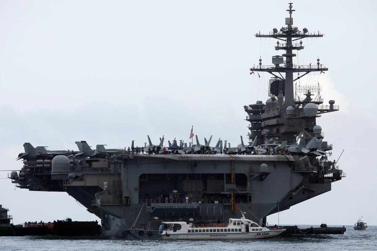 U.S. Navy relieves commander of coronavirus-stricken aircraft carrier