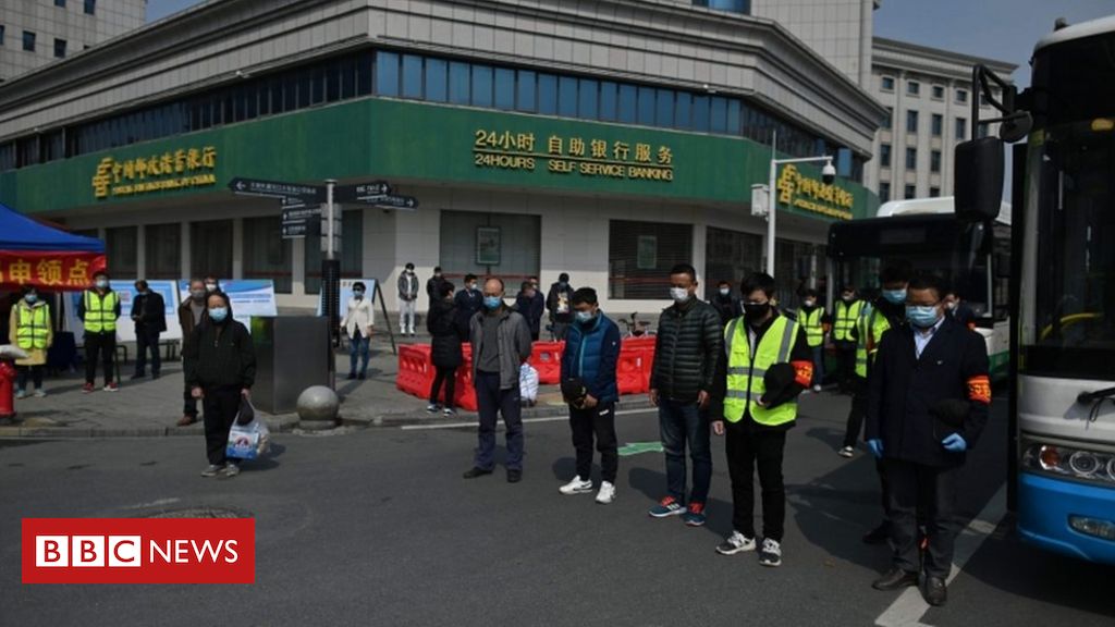 China holds three-minute silence for virus victims