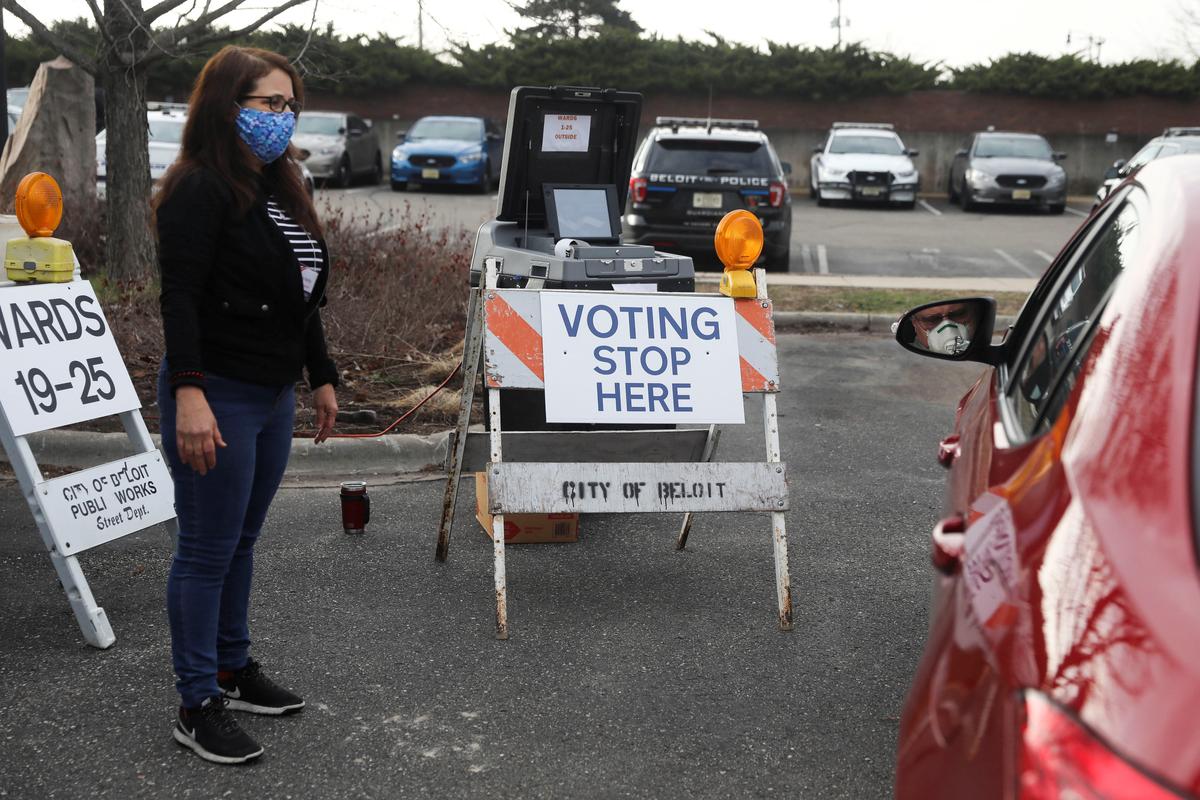 Long lines and drive-through voting as Wisconsinites brave coronavirus at polls