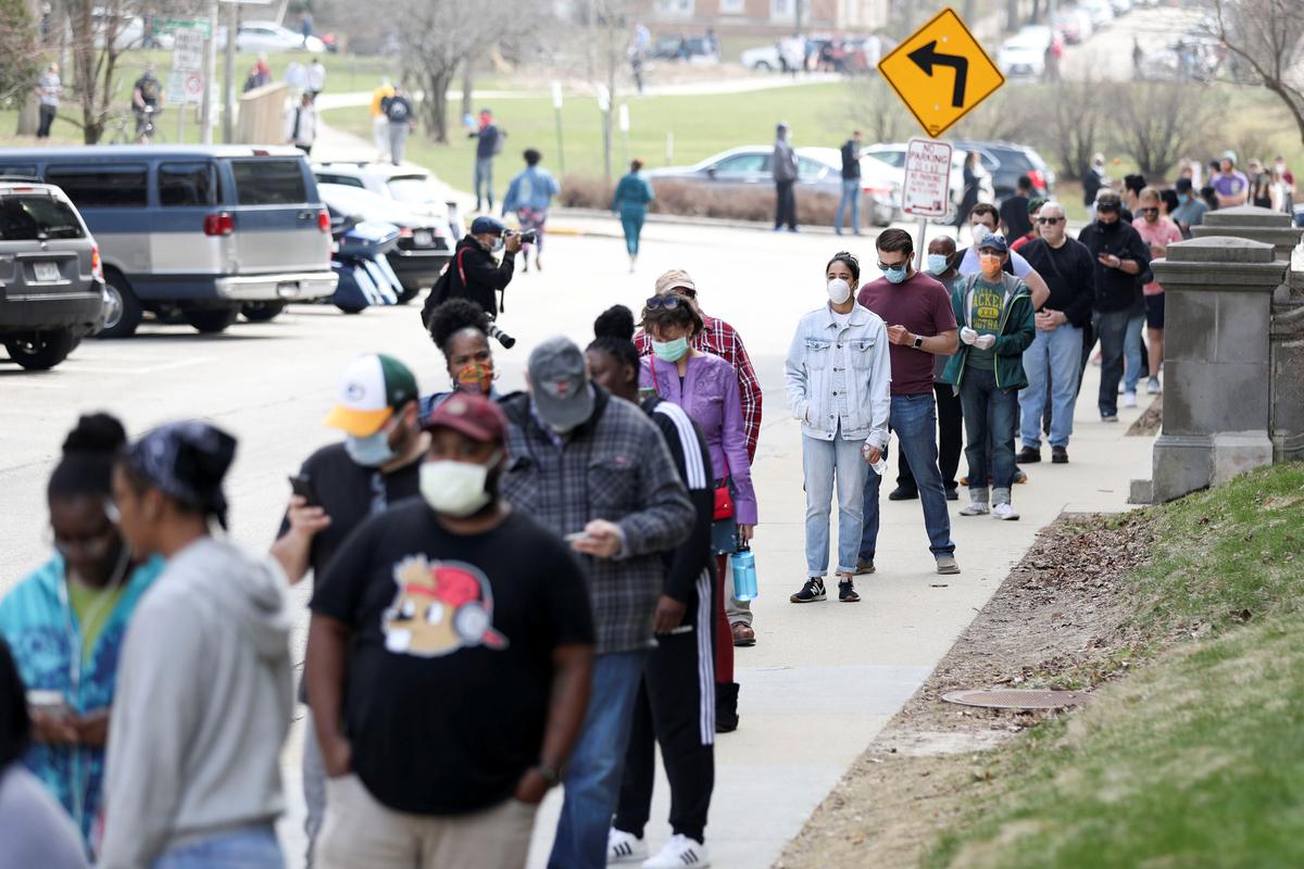 Long lines and frustration as Wisconsinites brave voting amid pandemic