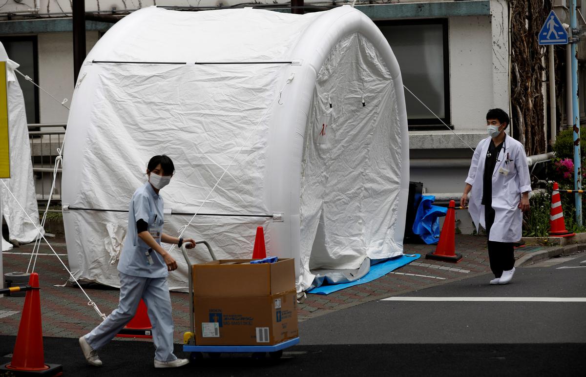 As coronavirus infections install, Japan at last expands checking