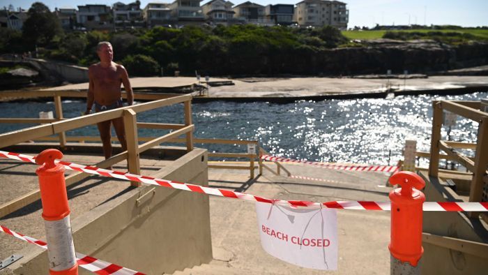 Relief and fear over decision to re-open Sydney beaches in coronavirus hotspot