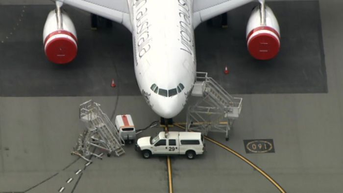 Cars and trucks, excavator used to impound Virgin planes at Perth Airport amidst stand-off over ‘considerable’ financial obligation