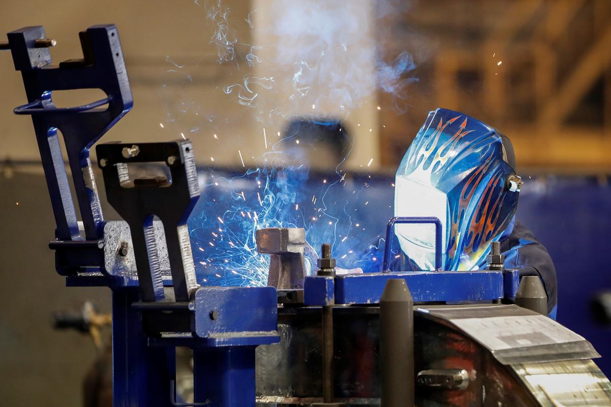 U.S. manufacturing activity plunges to 11-year low as orders sink