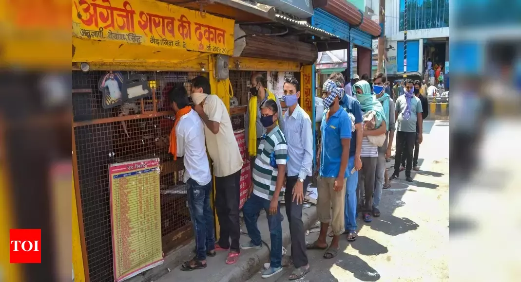 Liquor shops open after 40 days in lockdown, social distancing rules taken for a ride