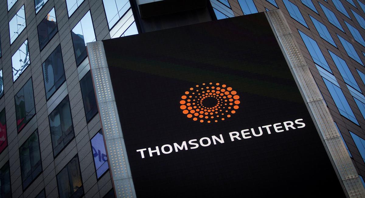 Thomson Reuters cuts sales outlook, narrowly misses earnings