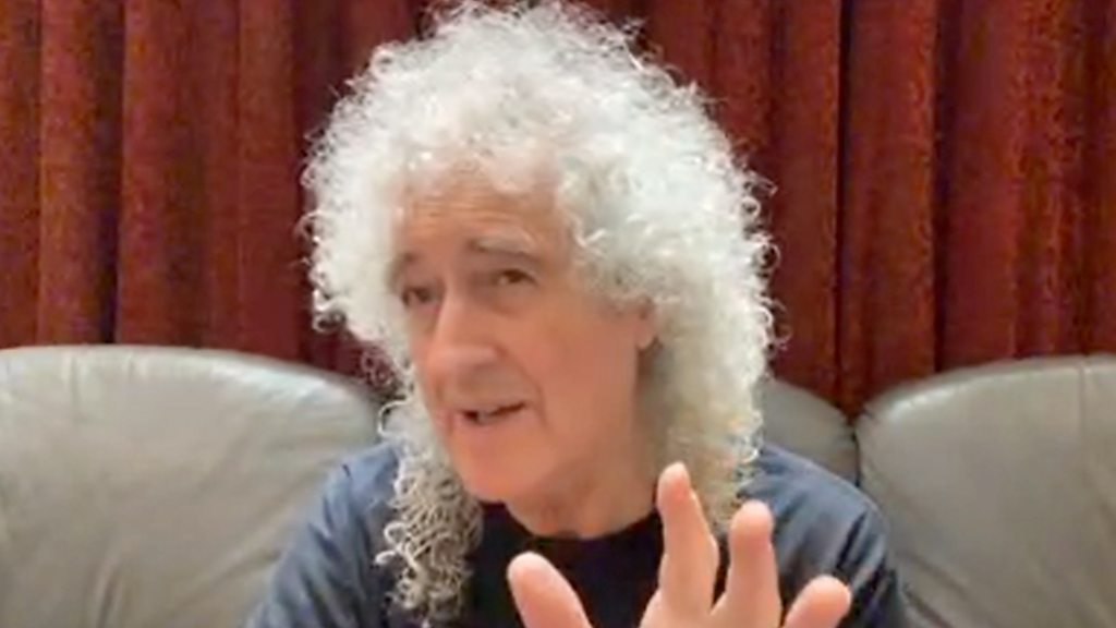 Queen’s Brian May rips glutes while gardening