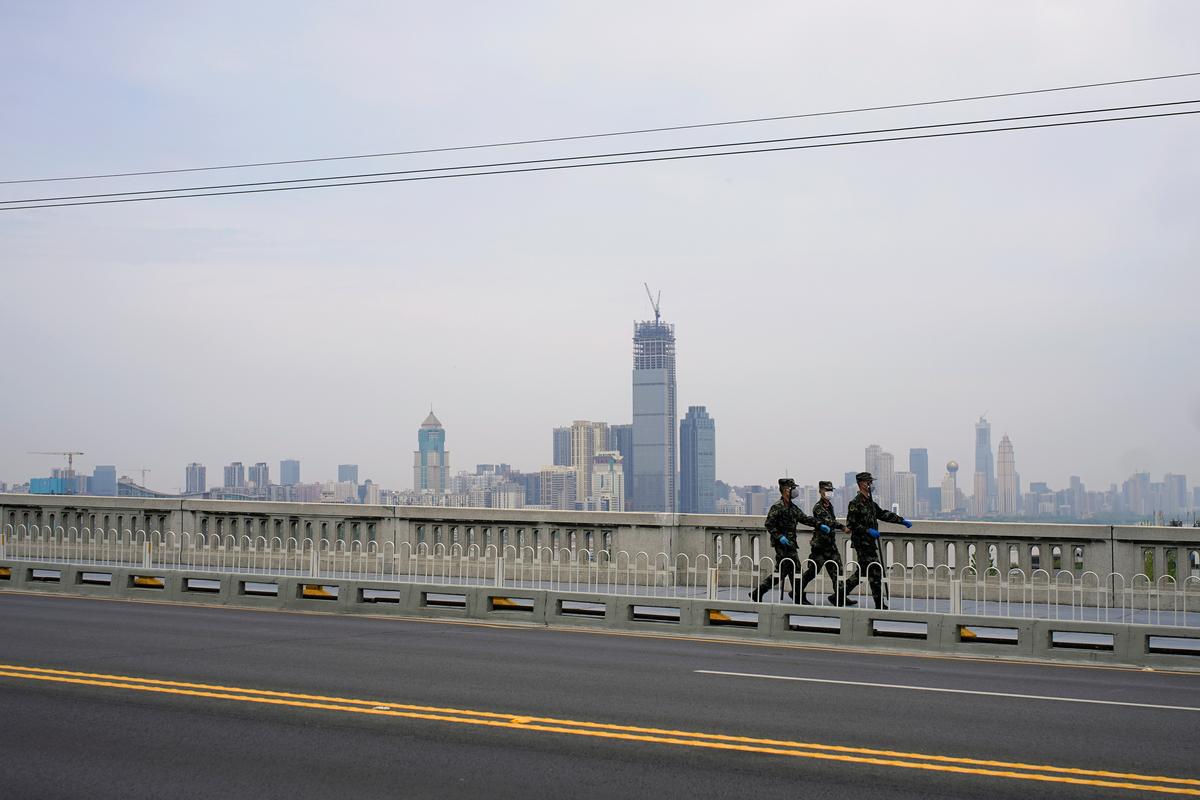 China reports first coronavirus case in Wuhan since April 3 among 14 new infections