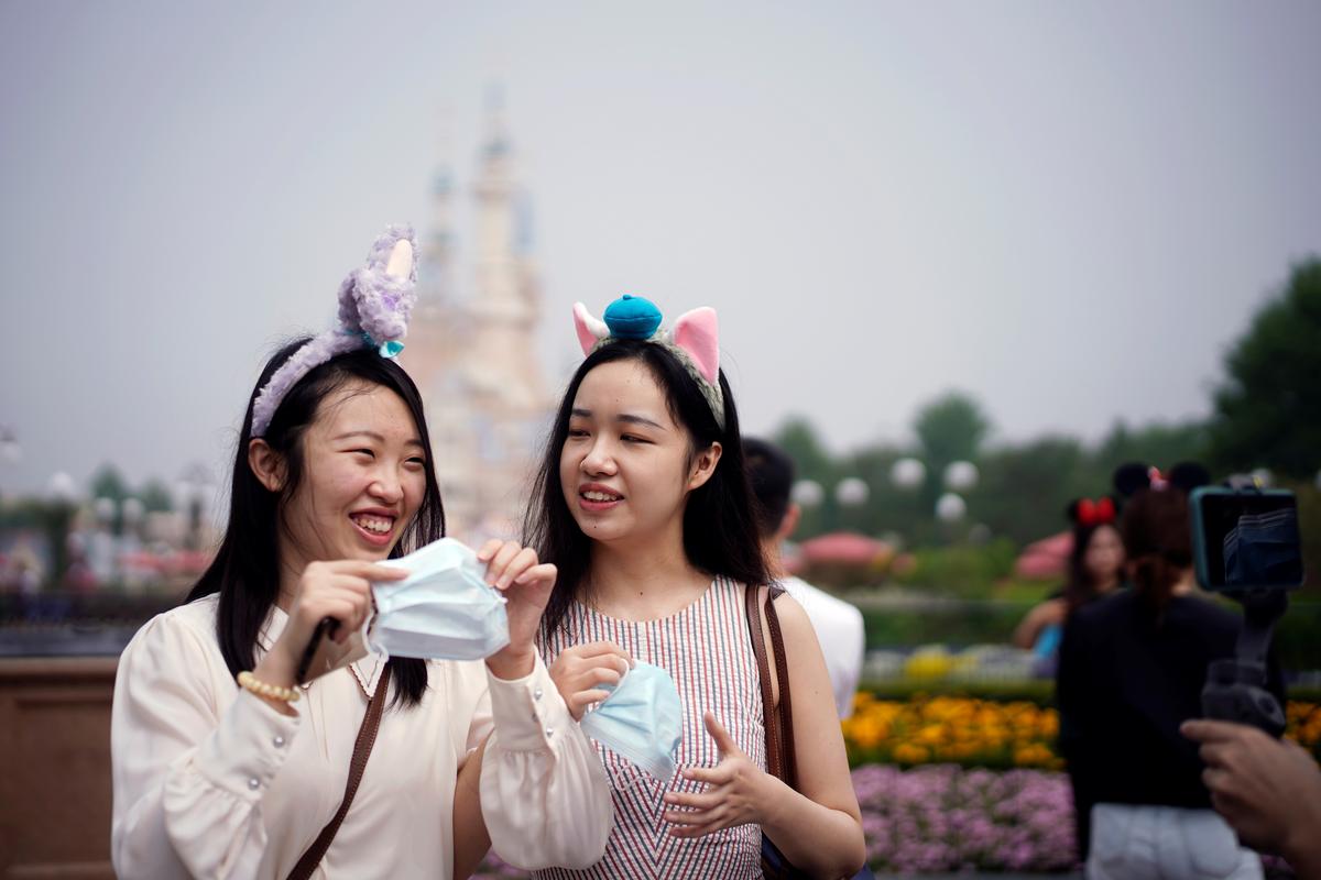 Paris salons, Shanghai Disney reopen despite global alarm over second wave