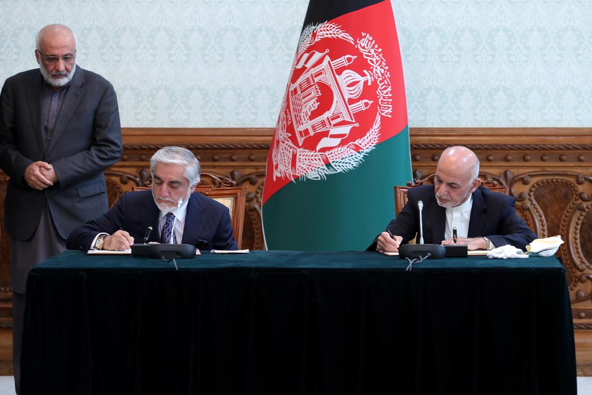 Afghan president and rival strike power-sharing deal after months of feuding