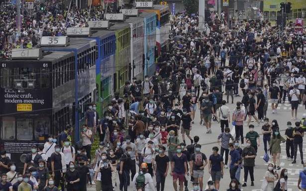 Hong Kong police fire tear gas on most significant demonstrations considering that COVID-19 curbs