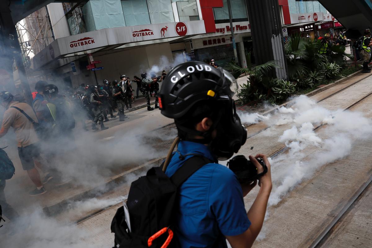 Hong Kong cops fire tear gas as protesters rise up against security law