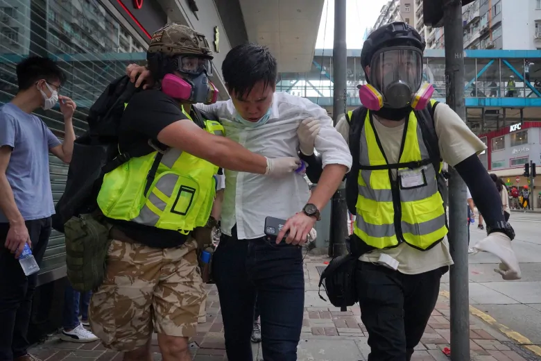 Hong Kong police fire tear gas, water cannon as thousands protest security laws | CBC News