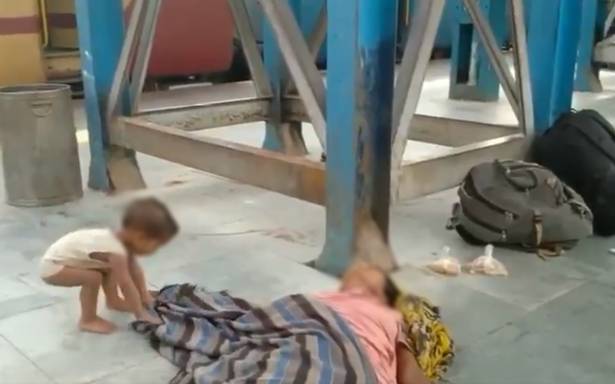 Video of child moving sheet covering dead mother at train station goes viral