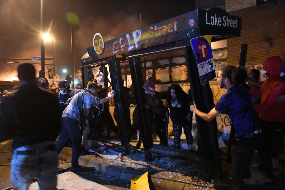 Racially charged violence rages for third night in Minneapolis