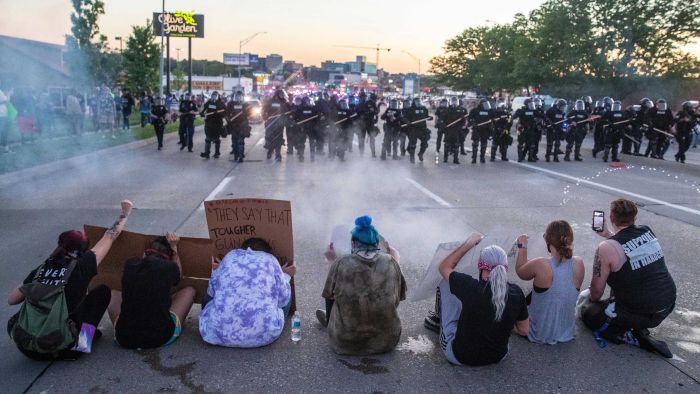 Police fire tear gas into crowds as protesters across US demand justice