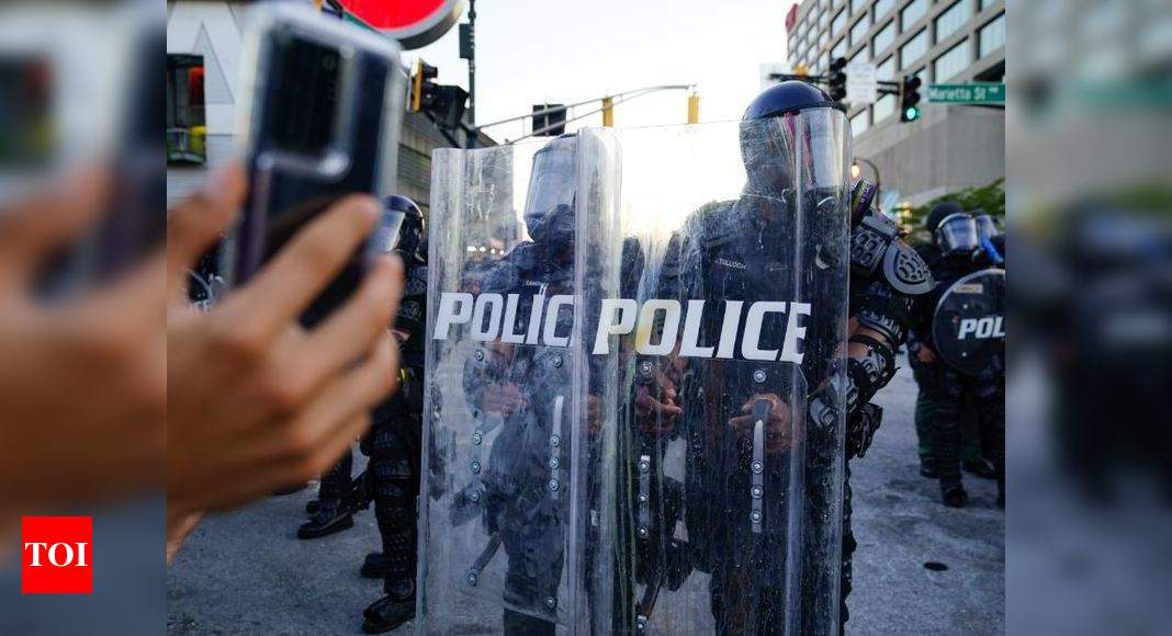 Protests over police killings rage in dozens of US cities