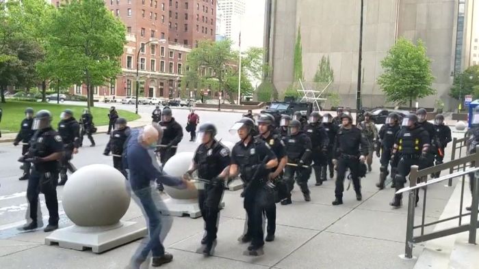 Officers suspended over video showing 75yo protester bleeding from the ears after being shoved to the ground