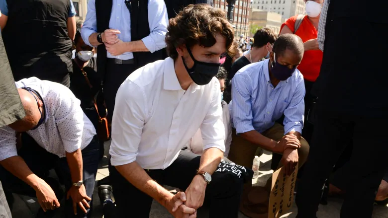 Trudeau takes a knee at anti-racism protest on Parliament Hill | CBC News