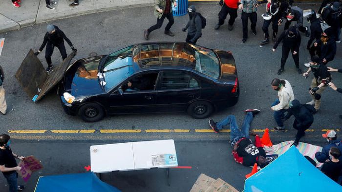 George Floyd protests: The minute a black protester is shot after man drives vehicle into Seattle presentation