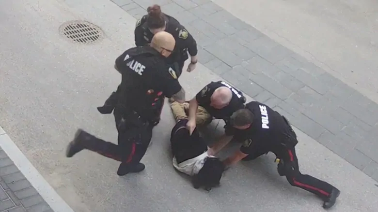 Video shows Winnipeg police kicking, kneeing man during arrest | CBC News