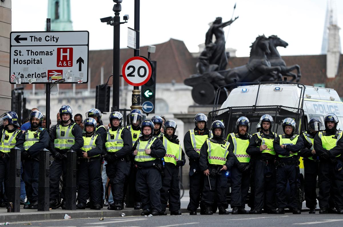 Reactionary and anti-racism protesters scuffle in London