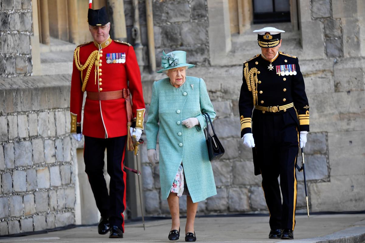 A scaled-down ceremony at Windsor marks Queen Elizabeth’s main birthday