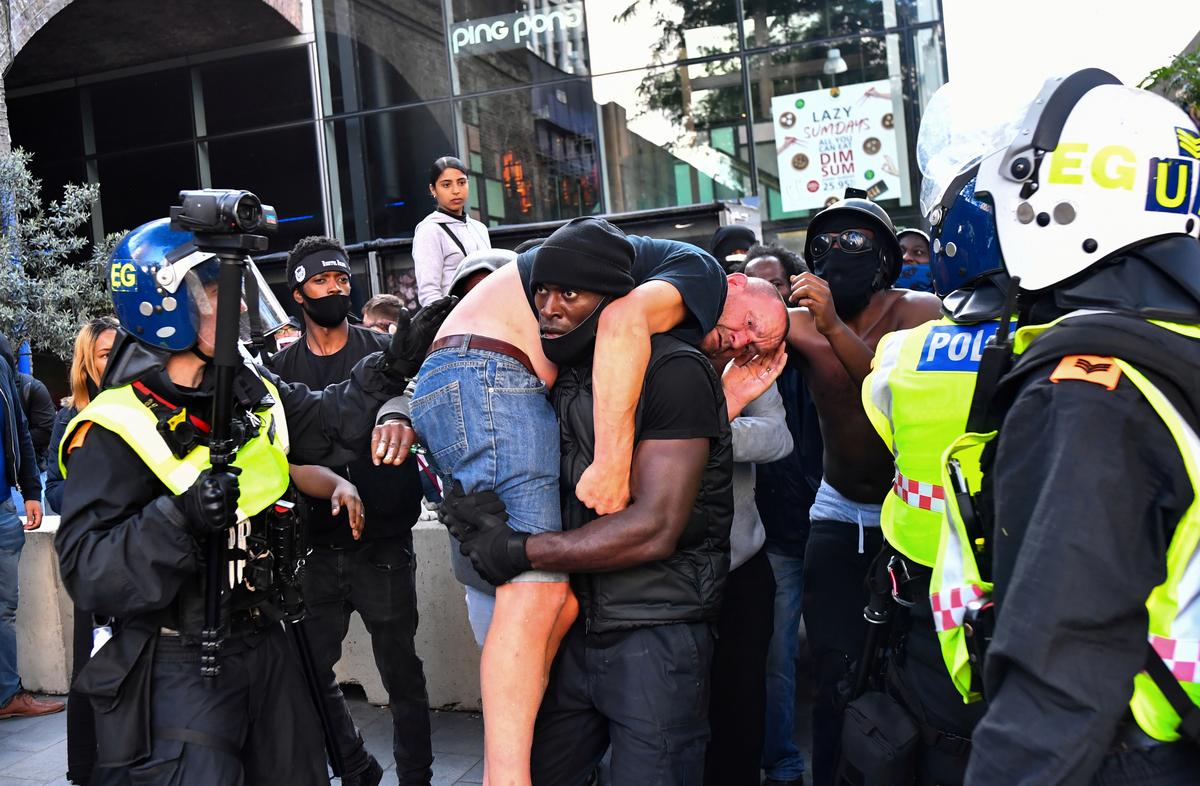 In London skirmishes, suspected far-right protester is rescued