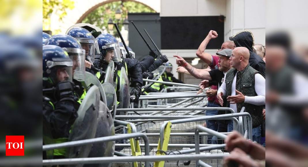 Patriots defending statues clash with Black Lives Matter protesters and police in London