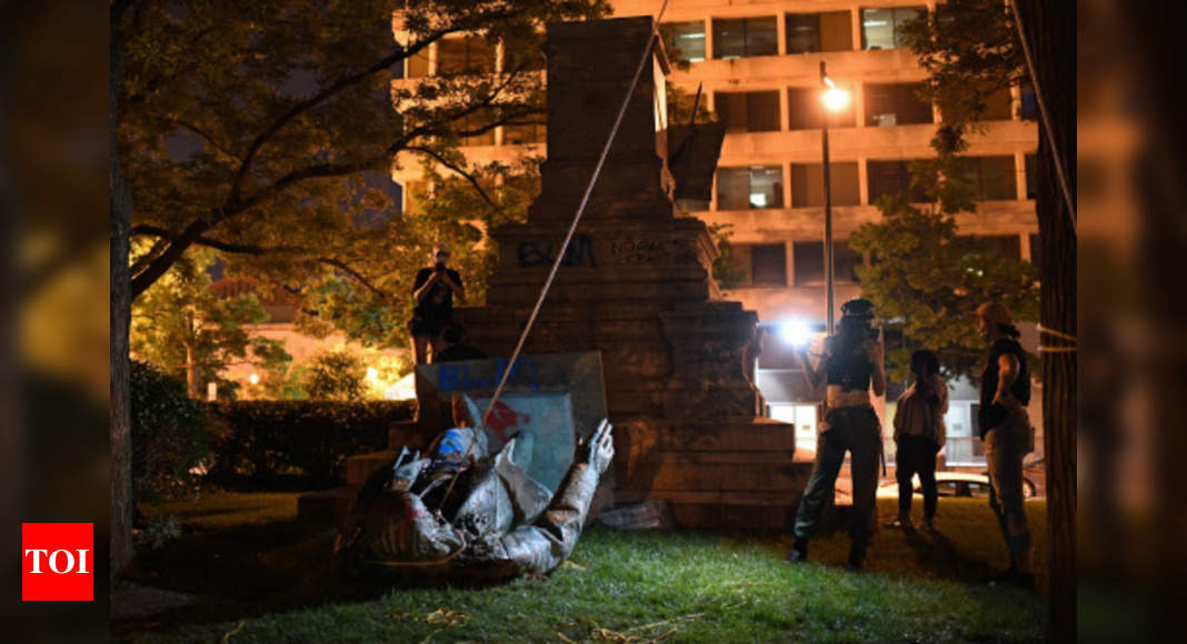 Statues and icons toppled in US in anti-racism protests as Trump rallies faithful