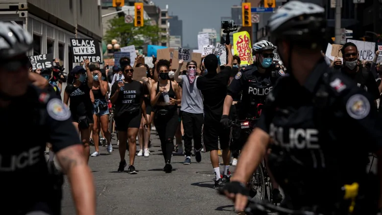 Cut Toronto police funding, or reform the force? Toronto council debates future of policing | CBC News