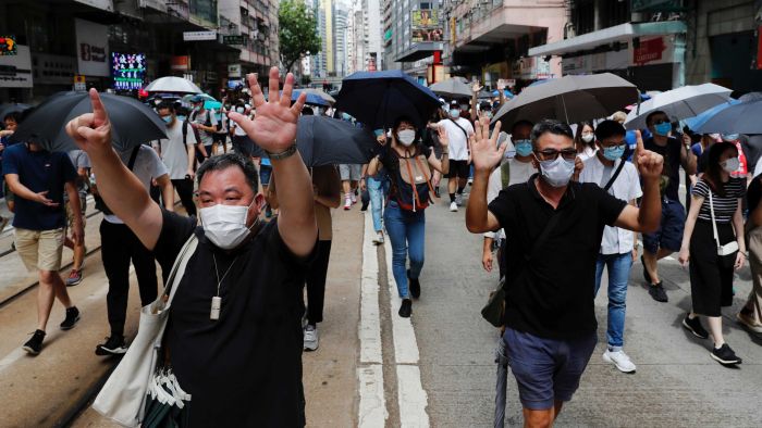 Hong Kong authorities fire water cannon at crowds protesting new security law