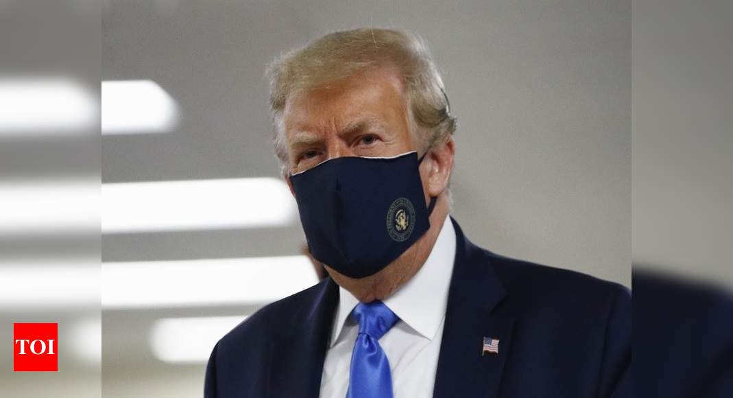 Subdued Trump finally promotes mask and mitigation measures as Covid-19 ravages America