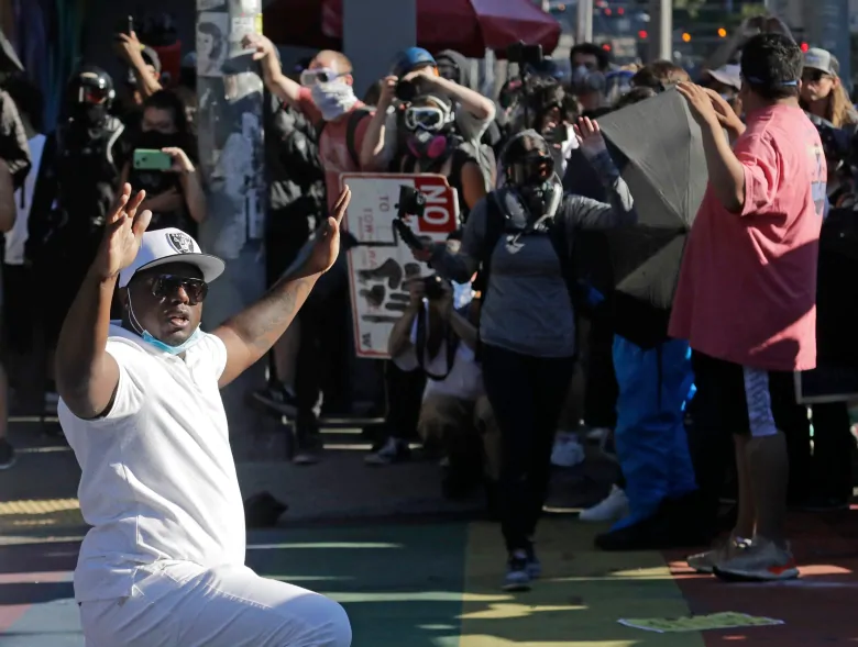 Seattle police declare demonstrations held in solidarity with Portland protests a riot | CBC News