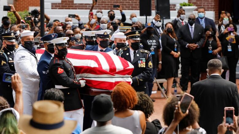 Casket of civil rights icon John Lewis crosses Selma bridge | CBC News