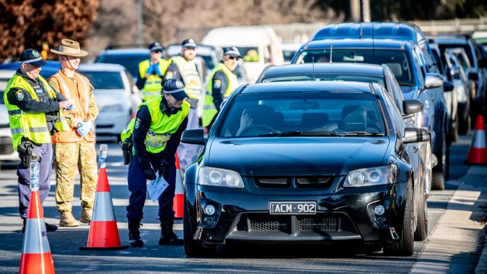 Police officer punched by man with outstanding warrants at NSW-Victoria border crossing