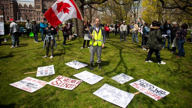 COVID-19 conspiracies creating a ‘public health crisis’ in Canada, experts say | CBC News