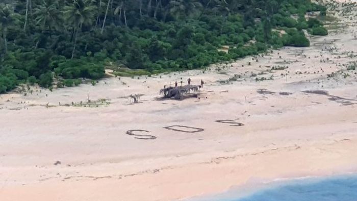 SOS message on Micronesian beach saves three stranded men after being spotted by Australian authorities