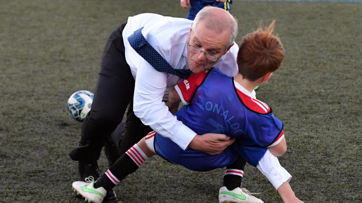 Scott Morrison wreck tackles minute one for the length of election marketing campaign soccer match in Tasmania