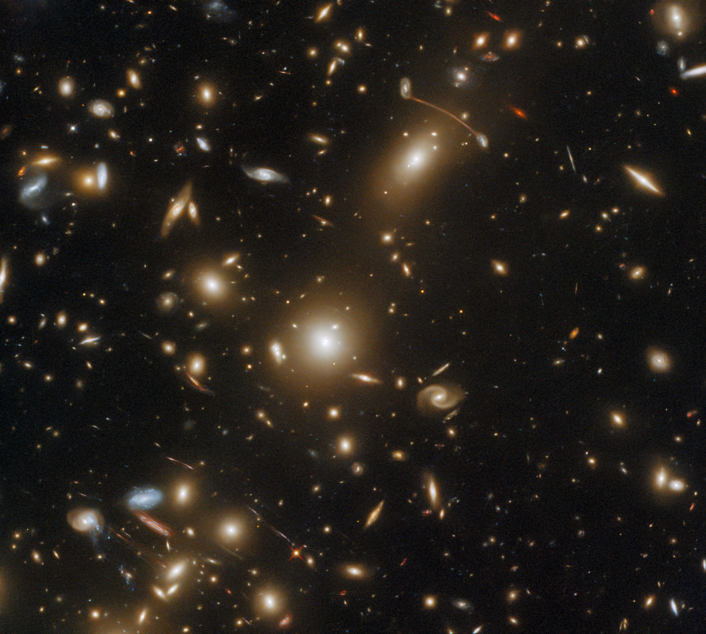 Hubble Captures Inconceivable Snapshot of a Huge Galaxy Cluster