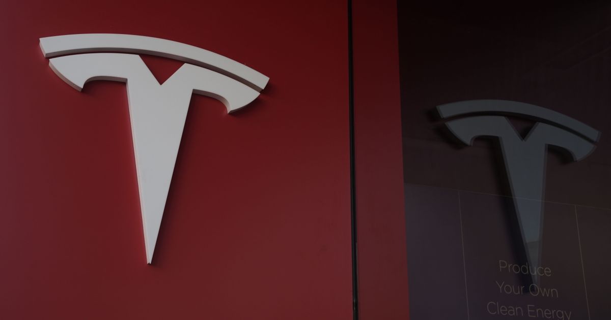 Tesla reports smaller than expected profit drop on label hikes