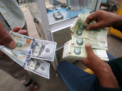 Iran’s embattled currency plunges to historical lows in the middle of demonstrations