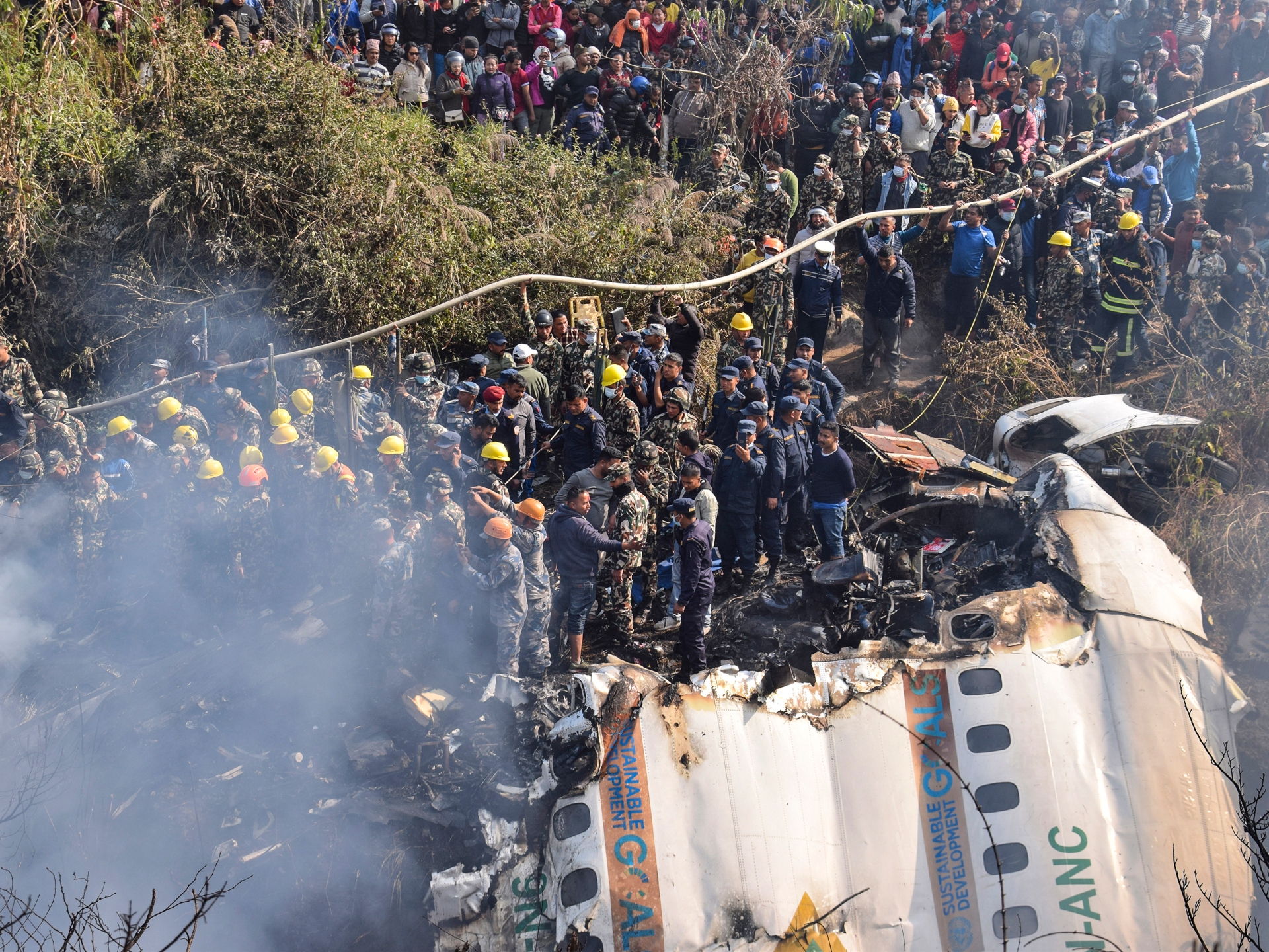 Grim job of recognizing the dead starts after Nepal airplane crash