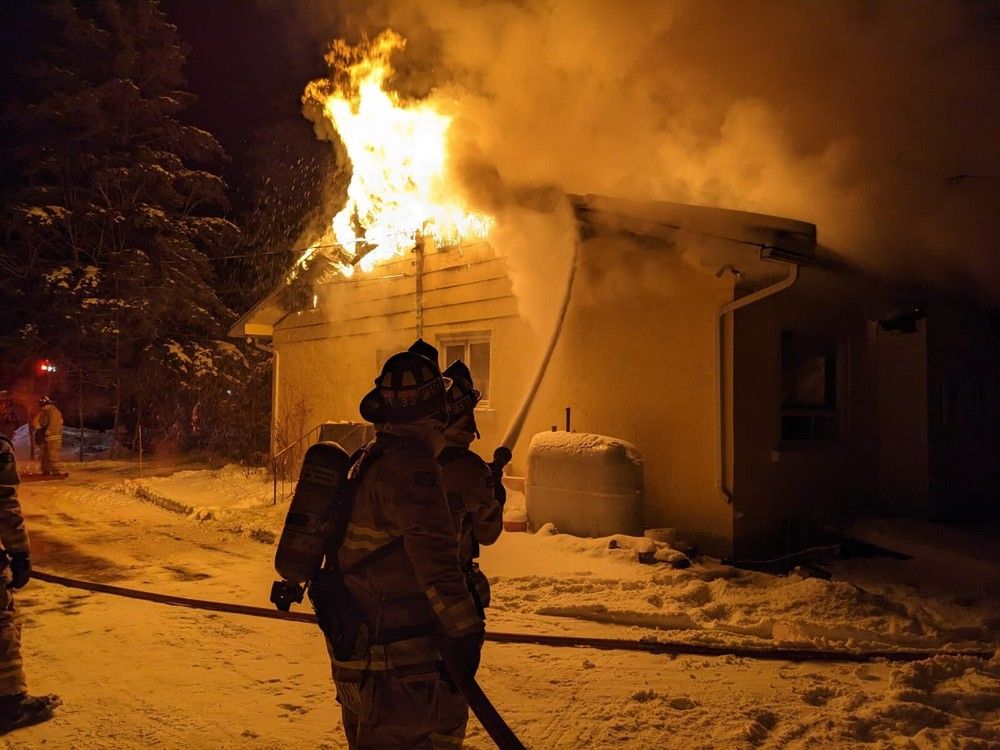 Firemens splash home fire on Bank Street in rural south Ottawa